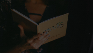 Woman reading a LoveBook